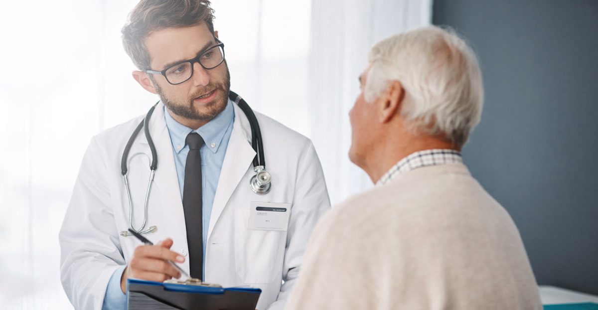 Doctor-reviewing-prostate-cancer-diagnosis-with-patient