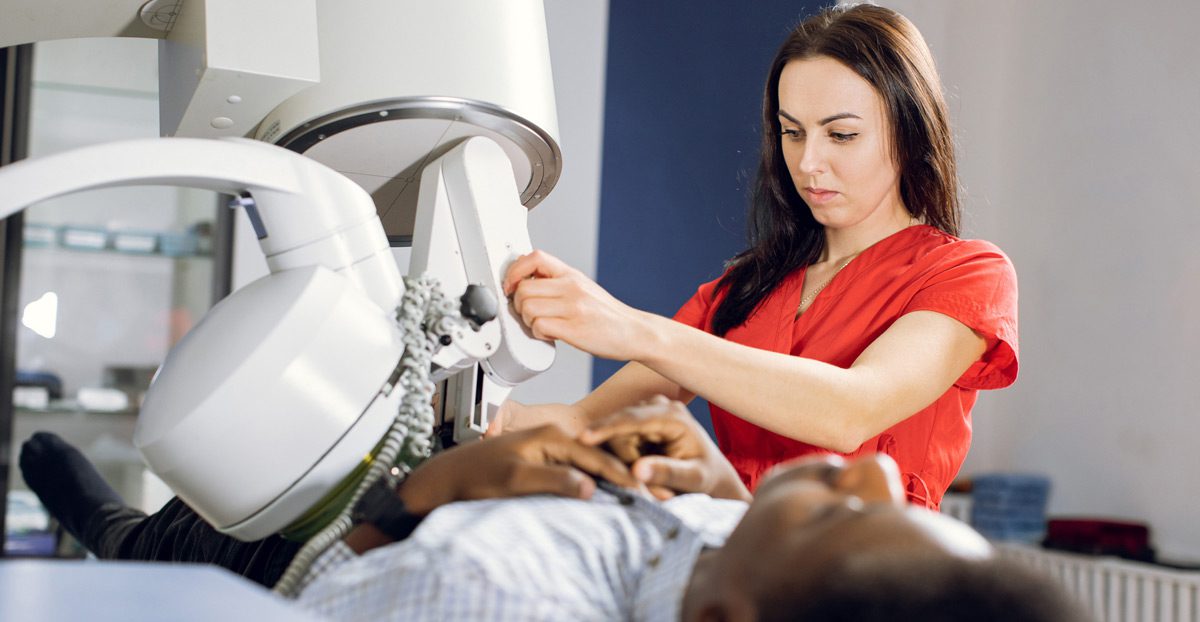 Female-physician-using-lithotripter-on-a-patient