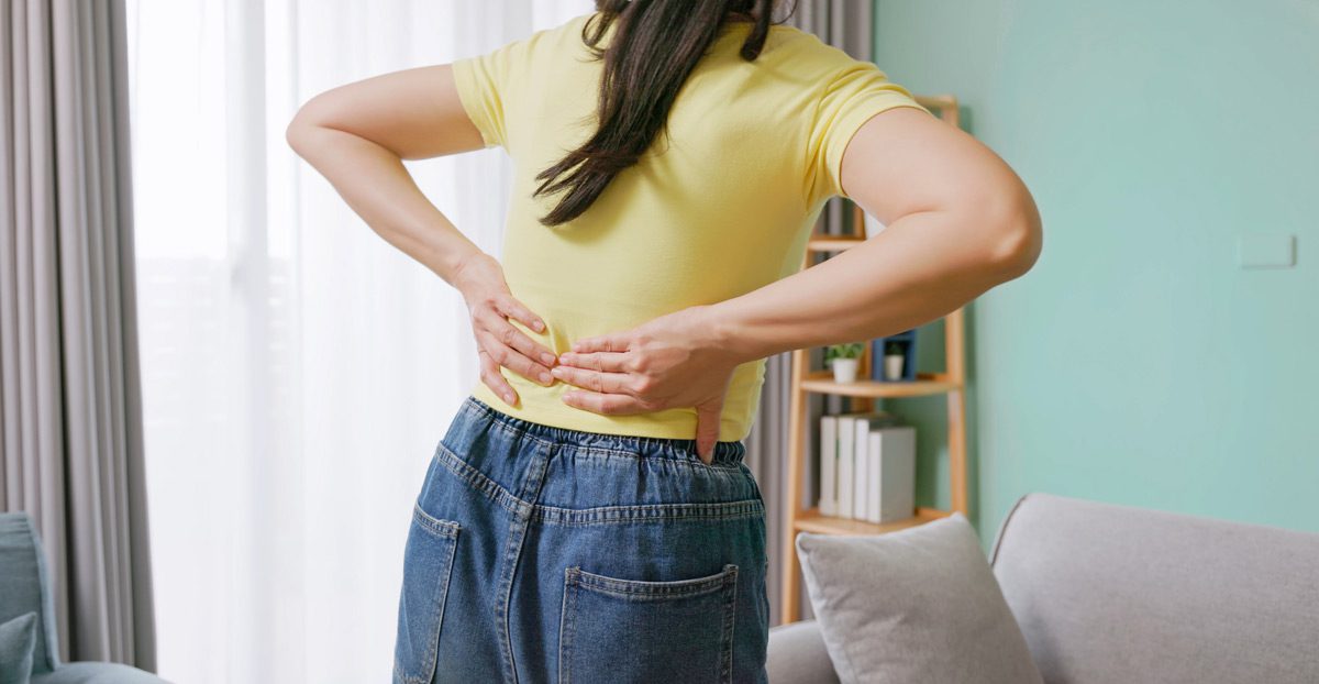 Woman-with-lower-back-pain Woman-with-lower-back-pain